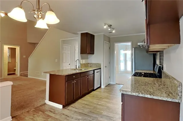 a spacious bathroom with a granite countertop sink a mirror and a shower
