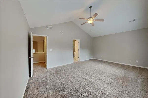 a view of a livingroom with a ceiling fan and window