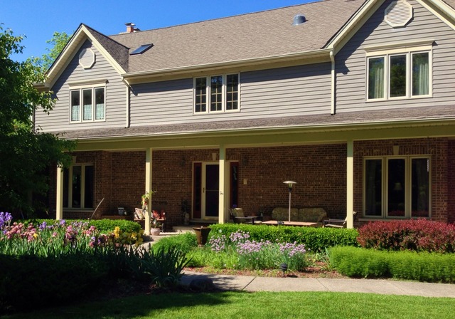 988 Plum Tree Road Fox River Grove, IL 60021 - Photo 1 of 25 a front view of a house with a yard