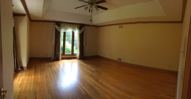 988 Plum Tree Road Fox River Grove, IL 60021 - Photo 11 of 25 a view of an empty room with a window