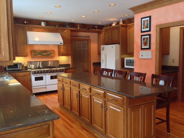 988 Plum Tree Road Fox River Grove, IL 60021 - Photo 6 of 25 a kitchen with stainless steel appliances granite countertop a sink stove and refrigerator
