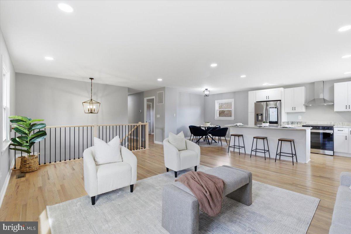 15810 Letcher Road Brandywine, MD 20613 - Photo 11 of 50 a living room with furniture and a wooden floor