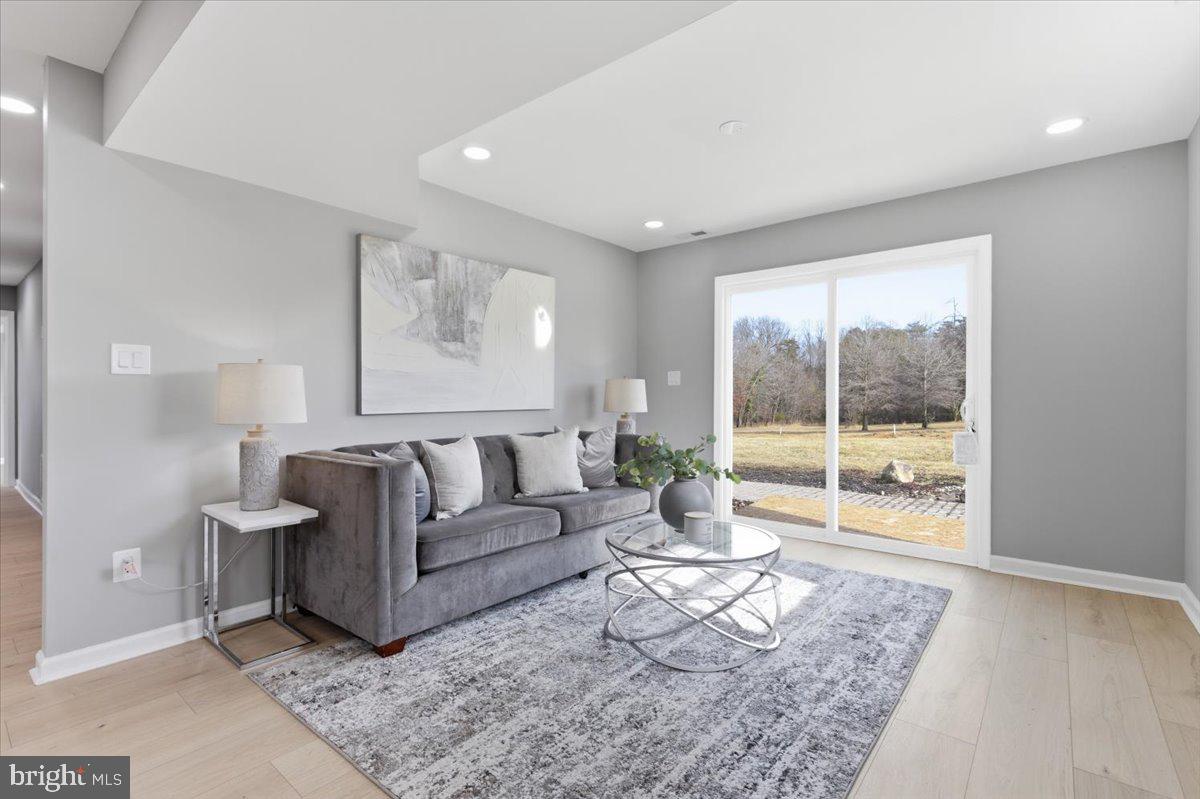 15810 Letcher Road Brandywine, MD 20613 - Photo 12 of 50 a living room with furniture and a large window