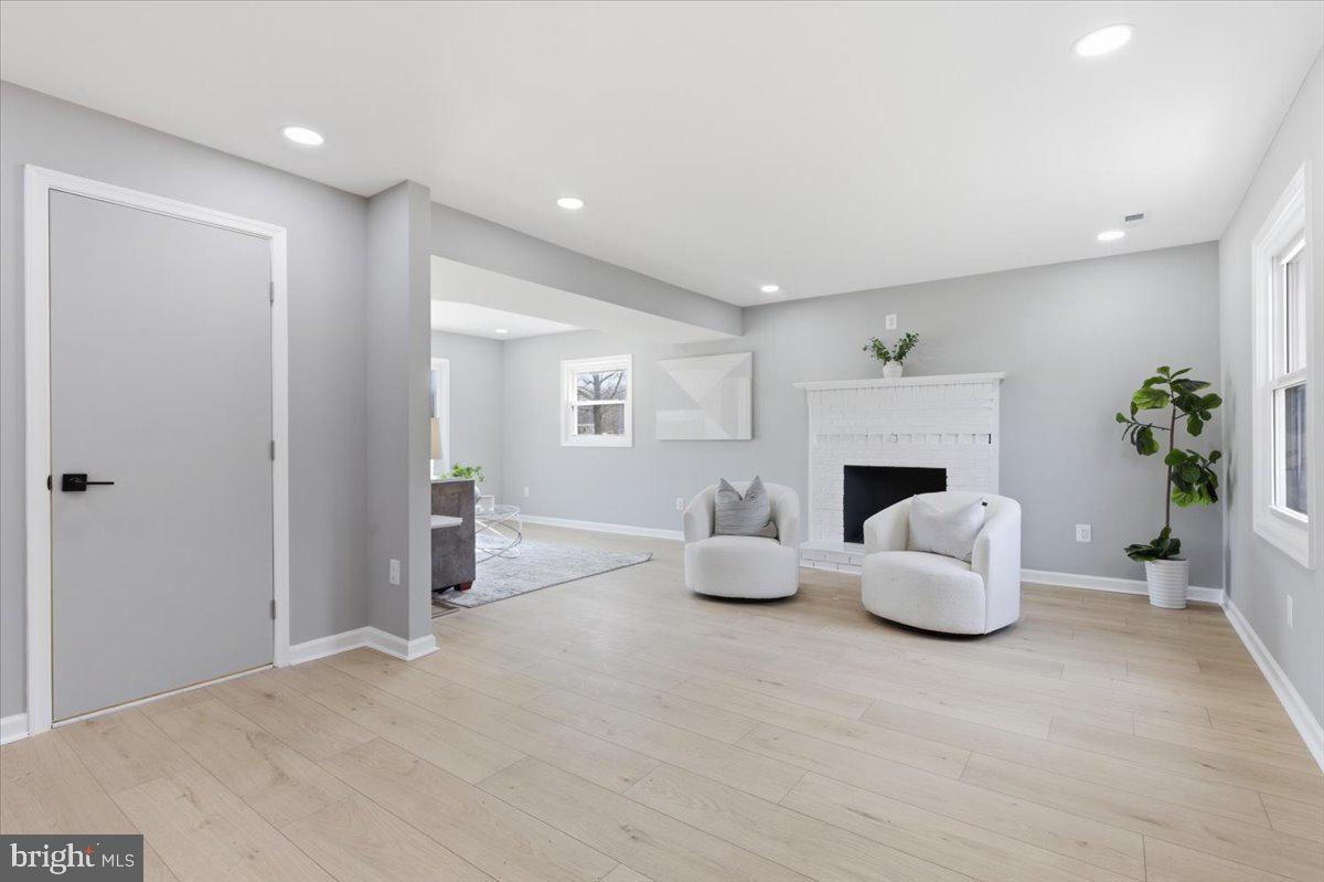 15810 Letcher Road Brandywine, MD 20613 - Photo 20 of 50 a living room with furniture and a fireplace