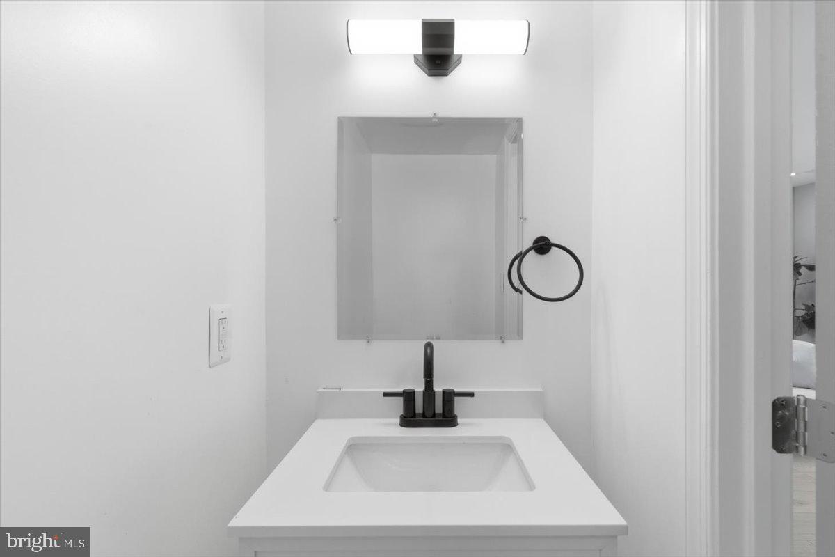 15810 Letcher Road Brandywine, MD 20613 - Photo 27 of 50 a bathroom with a sink and mirror