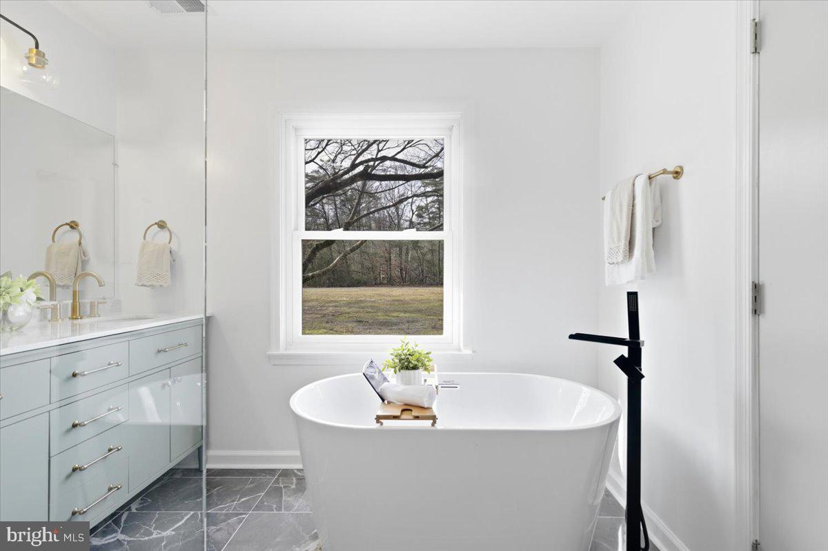 15810 Letcher Road Brandywine, MD 20613 - Photo 29 of 50 a bathroom with a sink and a window