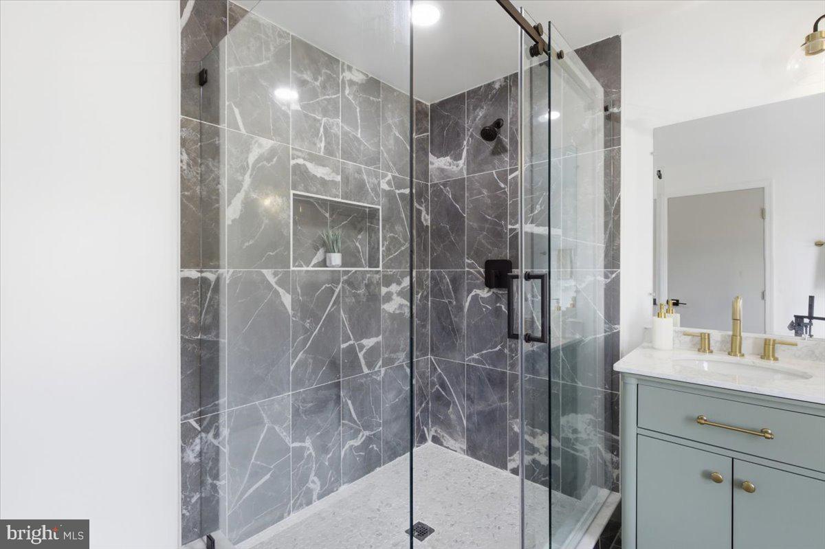 15810 Letcher Road Brandywine, MD 20613 - Photo 30 of 50 a bathroom with a shower and a sink