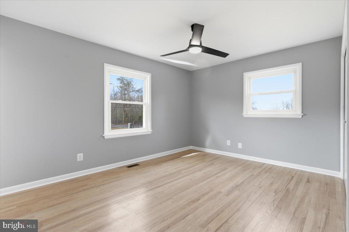 15810 Letcher Road Brandywine, MD 20613 - Photo 38 of 50 a view of an empty room with window and wooden floor