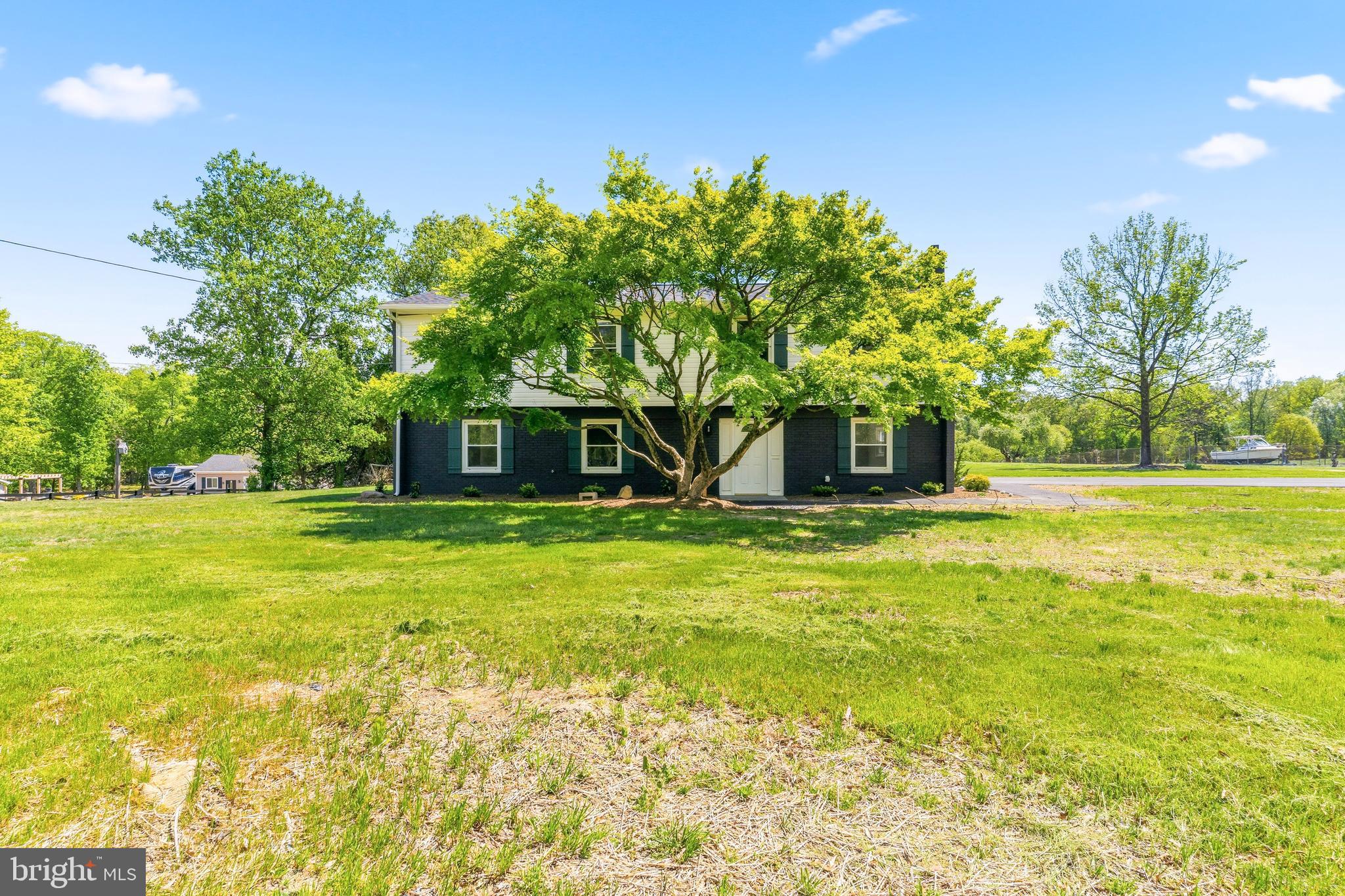 15810 Letcher Road Brandywine, MD 20613 - Photo 44 of 50 a front view of a house with a yard