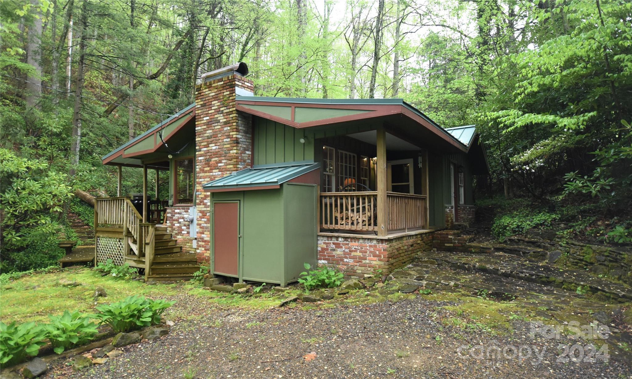 367 Johnson Branch Road Maggie Valley, NC 28751 - Photo 1 of 28 a view of a house with a yard