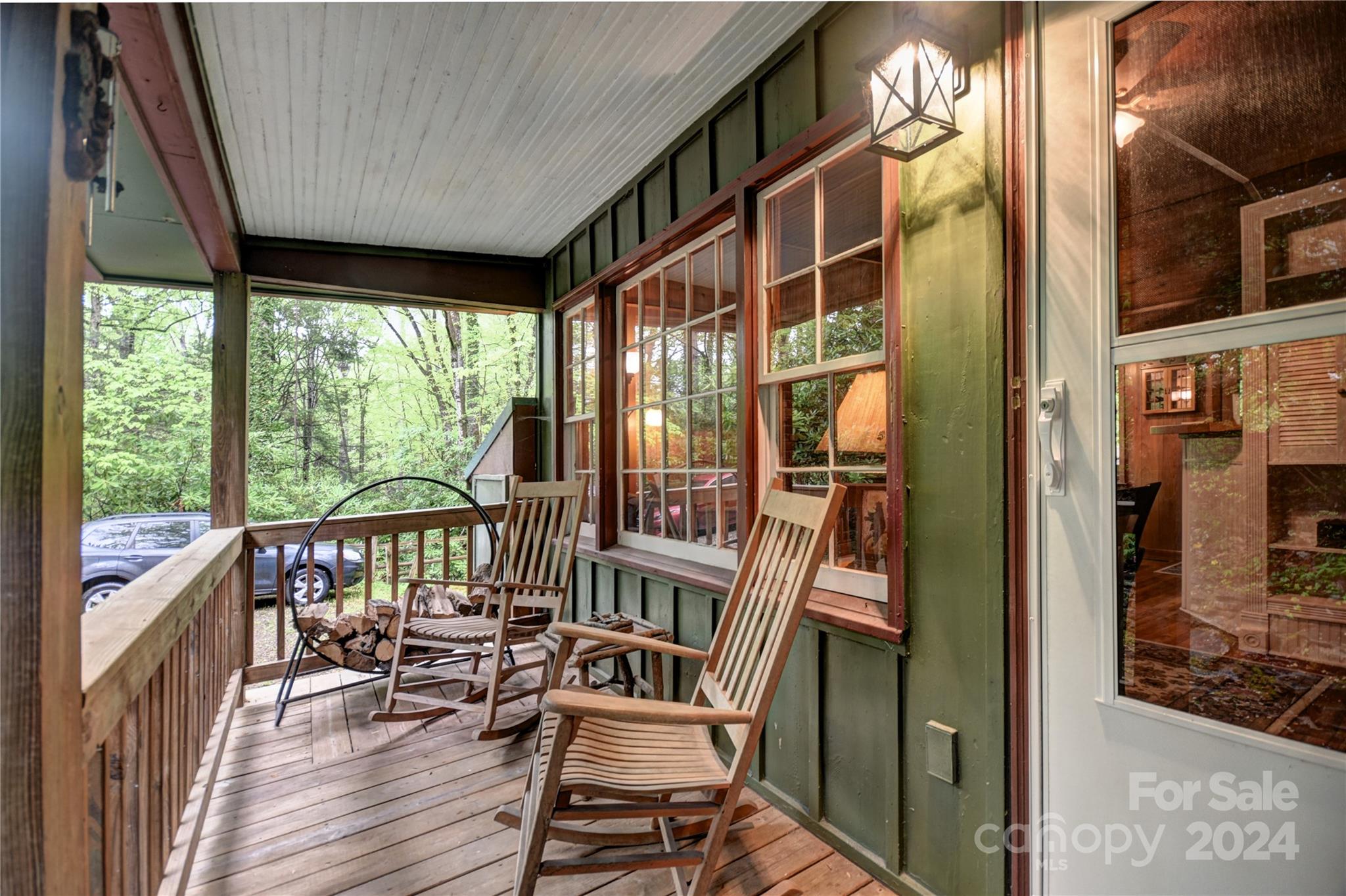 367 Johnson Branch Road Maggie Valley, NC 28751 - Photo 21 of 28 a view of balcony with chairs and wooden floor
