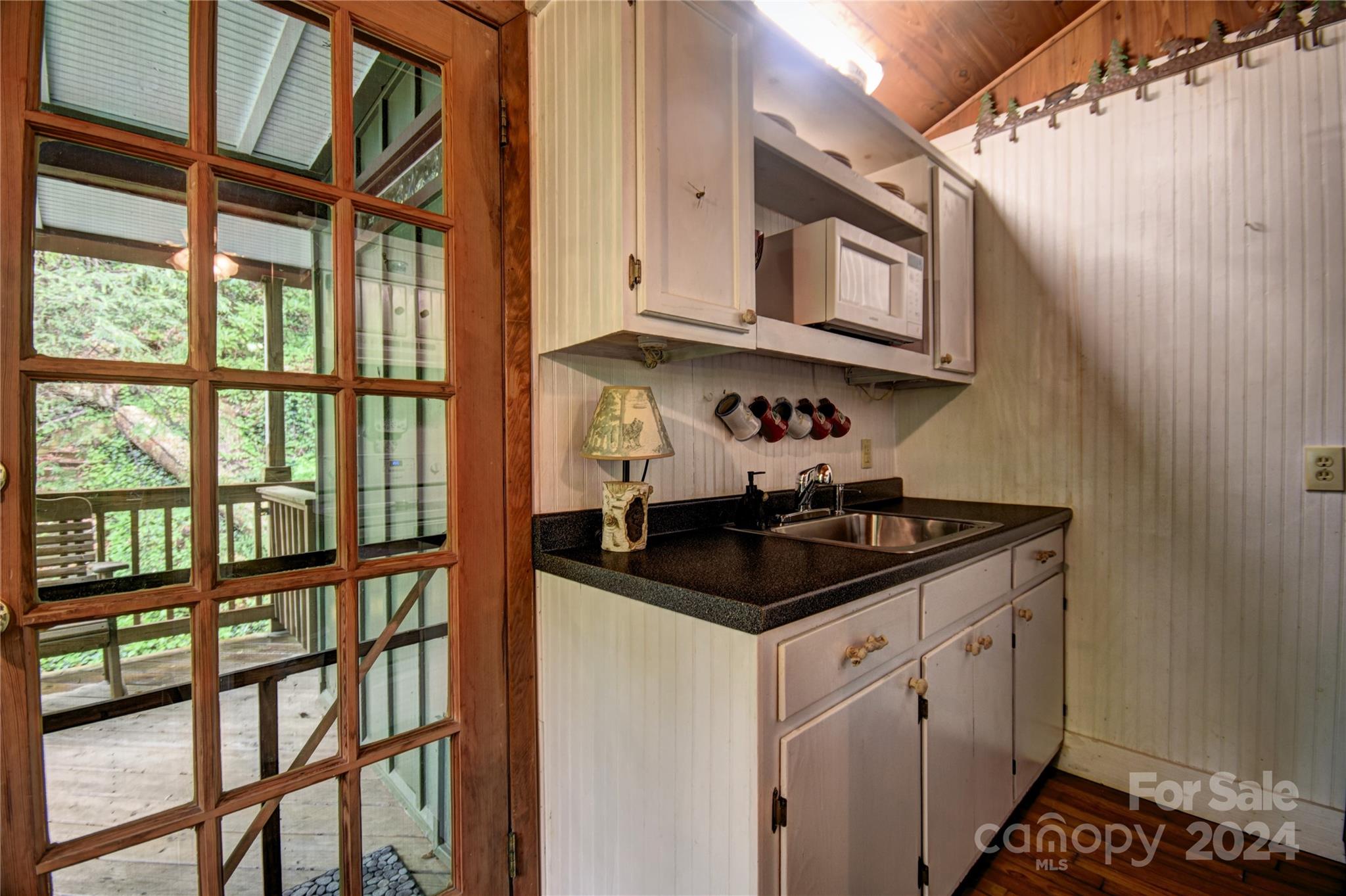 367 Johnson Branch Road Maggie Valley, NC 28751 - Photo 8 of 28 a kitchen with stainless steel appliances granite countertop a stove and a sink
