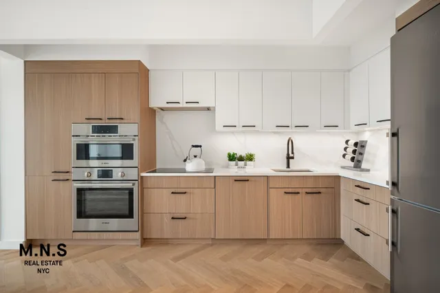 a kitchen with a table and chairs in it