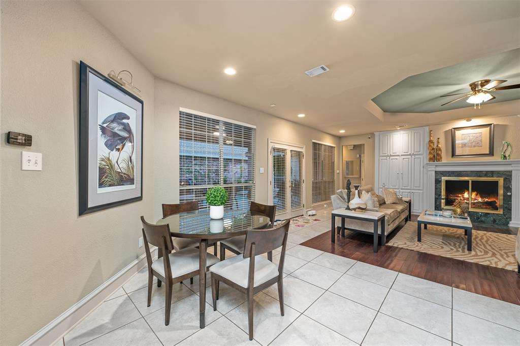 17608 Windflower Way Dallas, TX 75252 - Photo 11 of 34 Dining area featuring tile patterned floors, a fireplace, recessed lighting, french doors, and ceiling fan