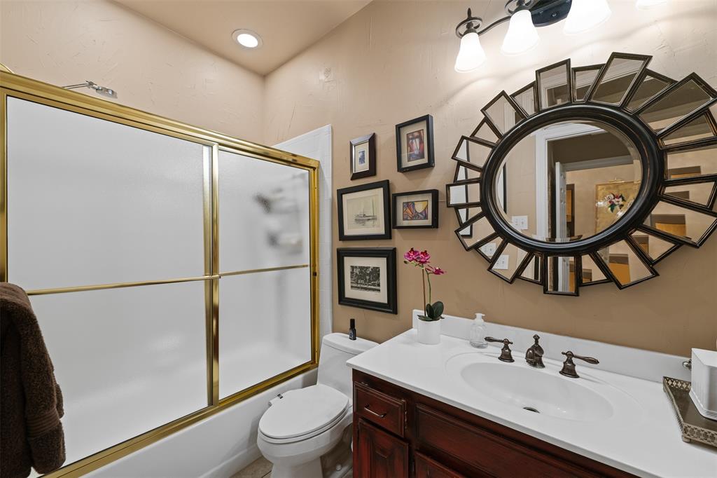17608 Windflower Way Dallas, TX 75252 - Photo 17 of 34 Bathroom with vanity, bath / shower combo with glass door, and recessed lighting