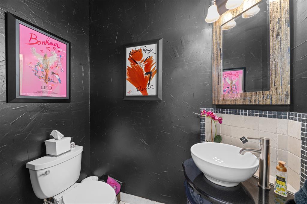 17608 Windflower Way Dallas, TX 75252 - Photo 18 of 34 Bathroom with tile walls, a textured wall, and vanity