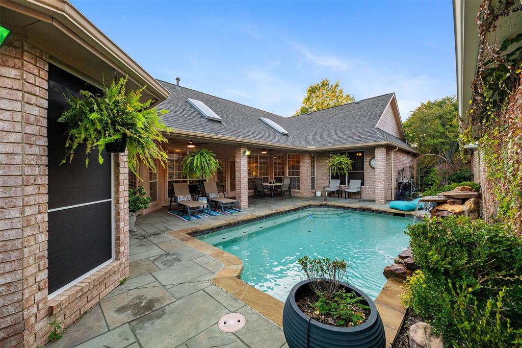 17608 Windflower Way Dallas, TX 75252 - Photo 25 of 34 Outdoor pool featuring a patio