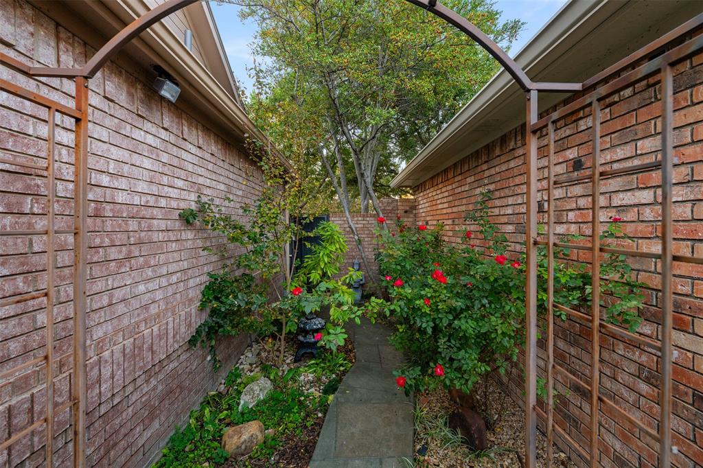 17608 Windflower Way Dallas, TX 75252 - Photo 28 of 34 View of side of home featuring brick siding