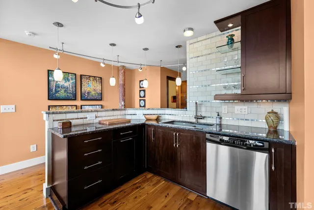 a kitchen with a sink and cabinets