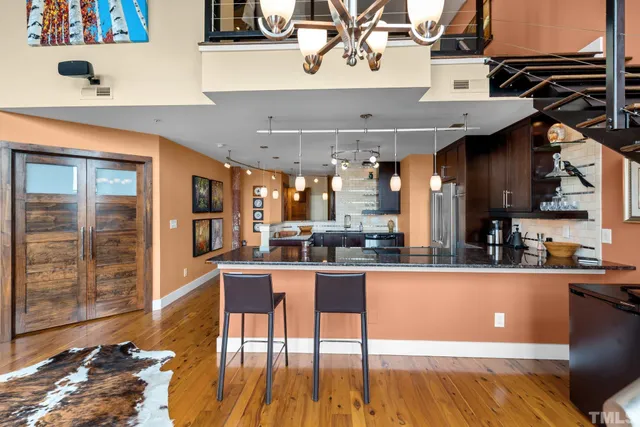 a kitchen with stainless steel appliances granite countertop a sink and cabinets