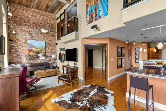 a living room with fireplace furniture and a flat screen tv