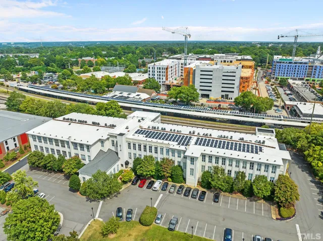 a view of a balcony with chair and a potted plant