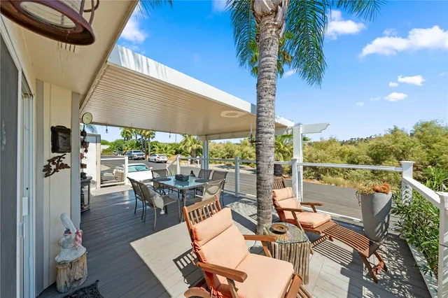 a living room with fireplace furniture and a chandelier