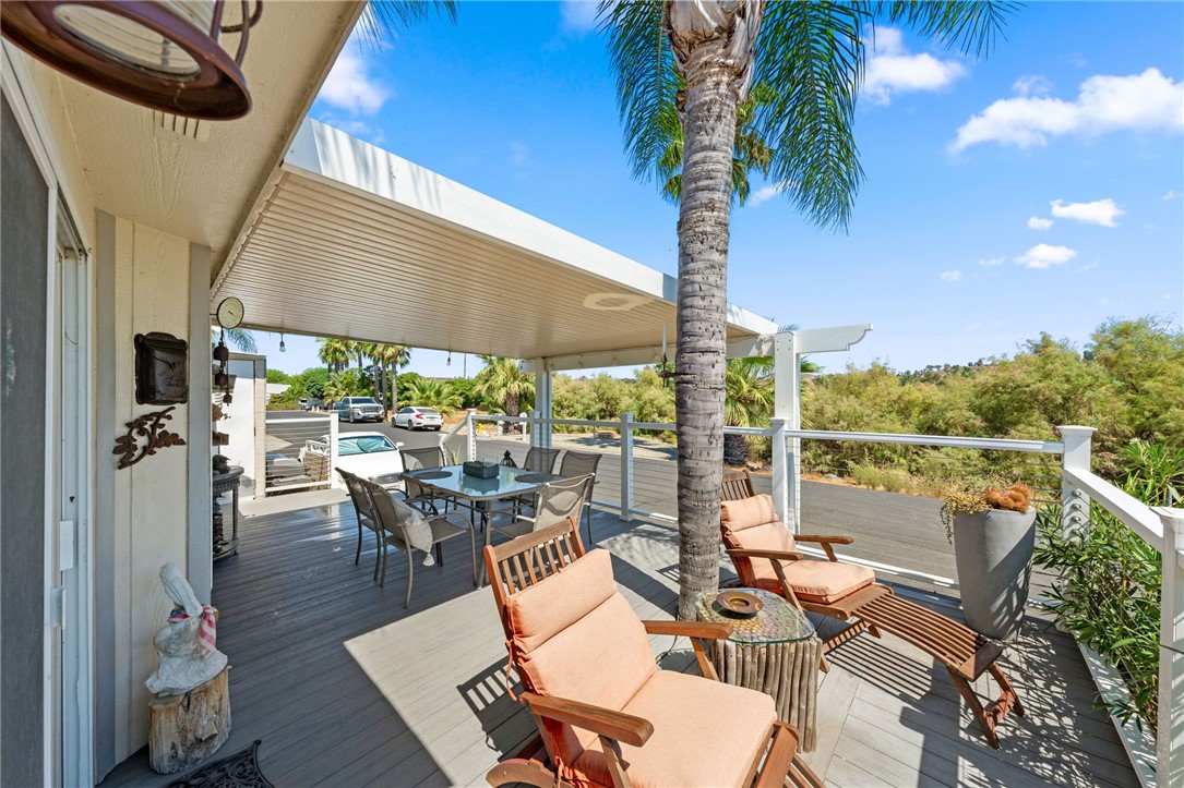 32000 Riverside Drive, Unit J8 Lake Elsinore, CA 92530 - Photo 13 of 33 a view of a patio with swimming pool table and chairs