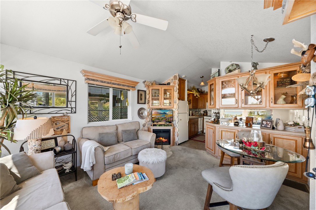 32000 Riverside Drive, Unit J8 Lake Elsinore, CA 92530 - Photo 17 of 33 a living room with furniture and a potted plant