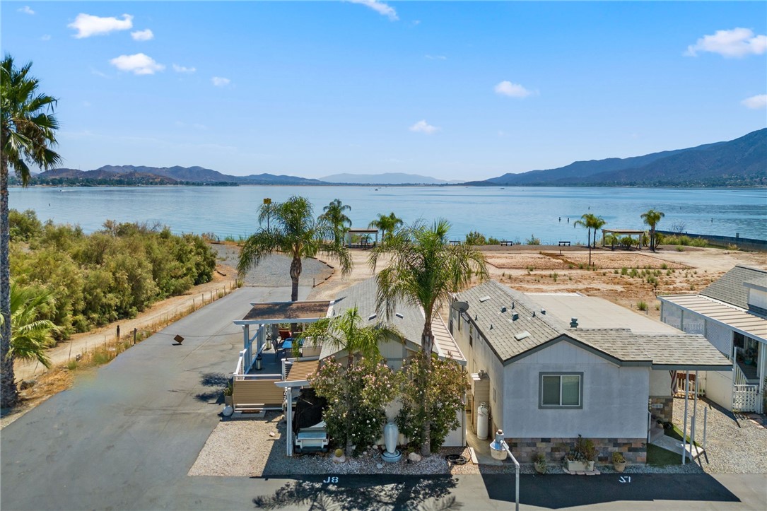 32000 Riverside Drive, Unit J8 Lake Elsinore, CA 92530 - Photo 28 of 33 a view of a terrace with wooden floor and lake view