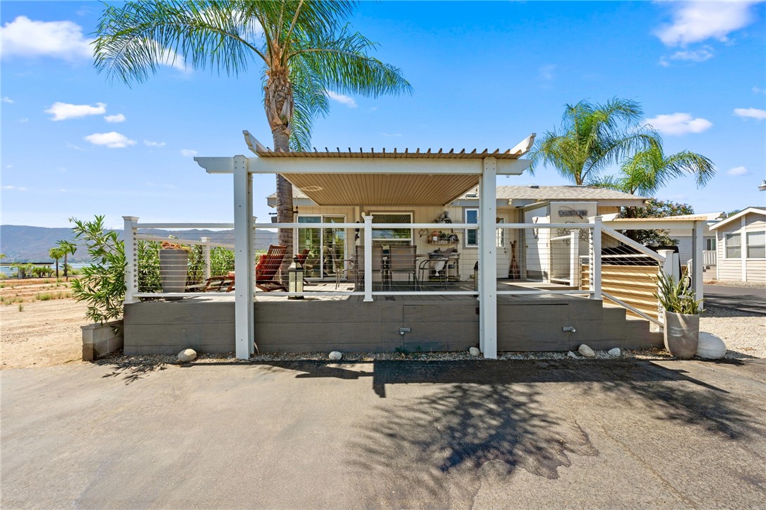 32000 Riverside Drive, Unit J8 Lake Elsinore, CA 92530 - Photo 7 of 33 front view of a house with a yard