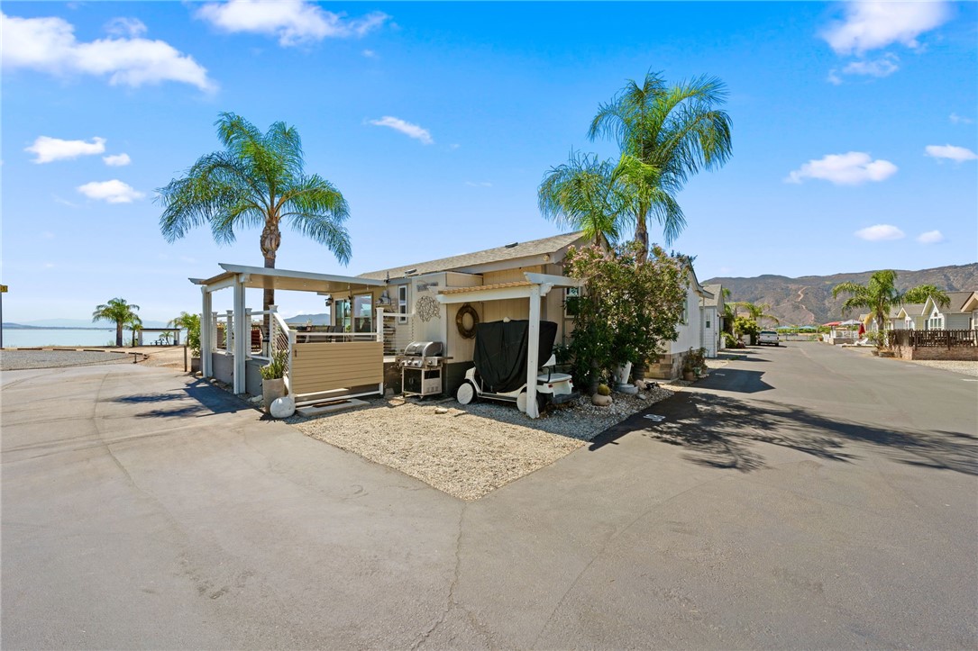 32000 Riverside Drive, Unit J8 Lake Elsinore, CA 92530 - Photo 8 of 33 a view of a street with cars