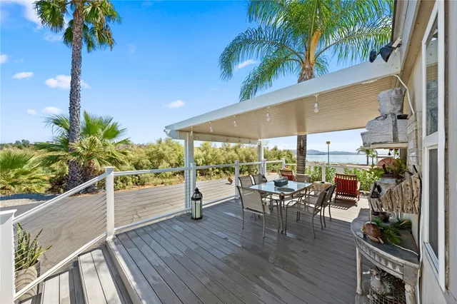 a view of a patio with table and chairs