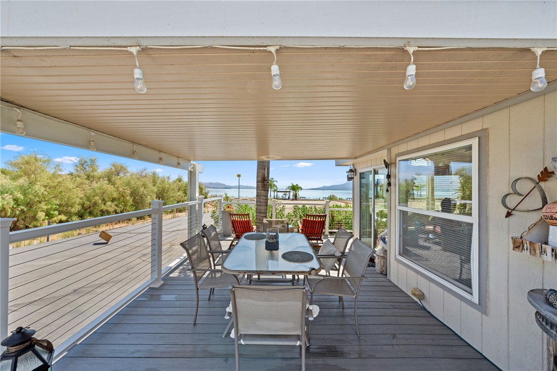 32000 Riverside Drive, Unit J8 Lake Elsinore, CA 92530 - Photo 10 of 33 a view of a patio with table and chairs
