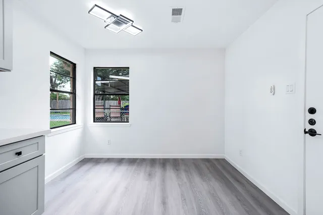 an empty room with windows