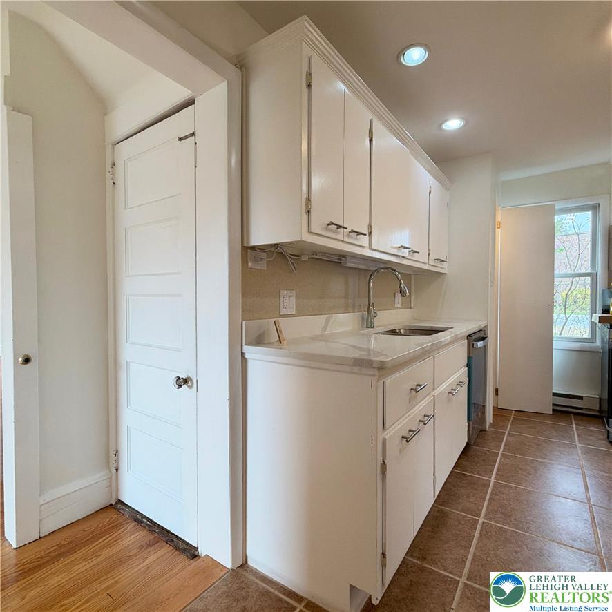 5111 Vera Cruz Road Emmaus, PA 18049 - Photo 17 of 44 Gleaming stone countertops and classic cabinetry elevate this efficient culinary space.