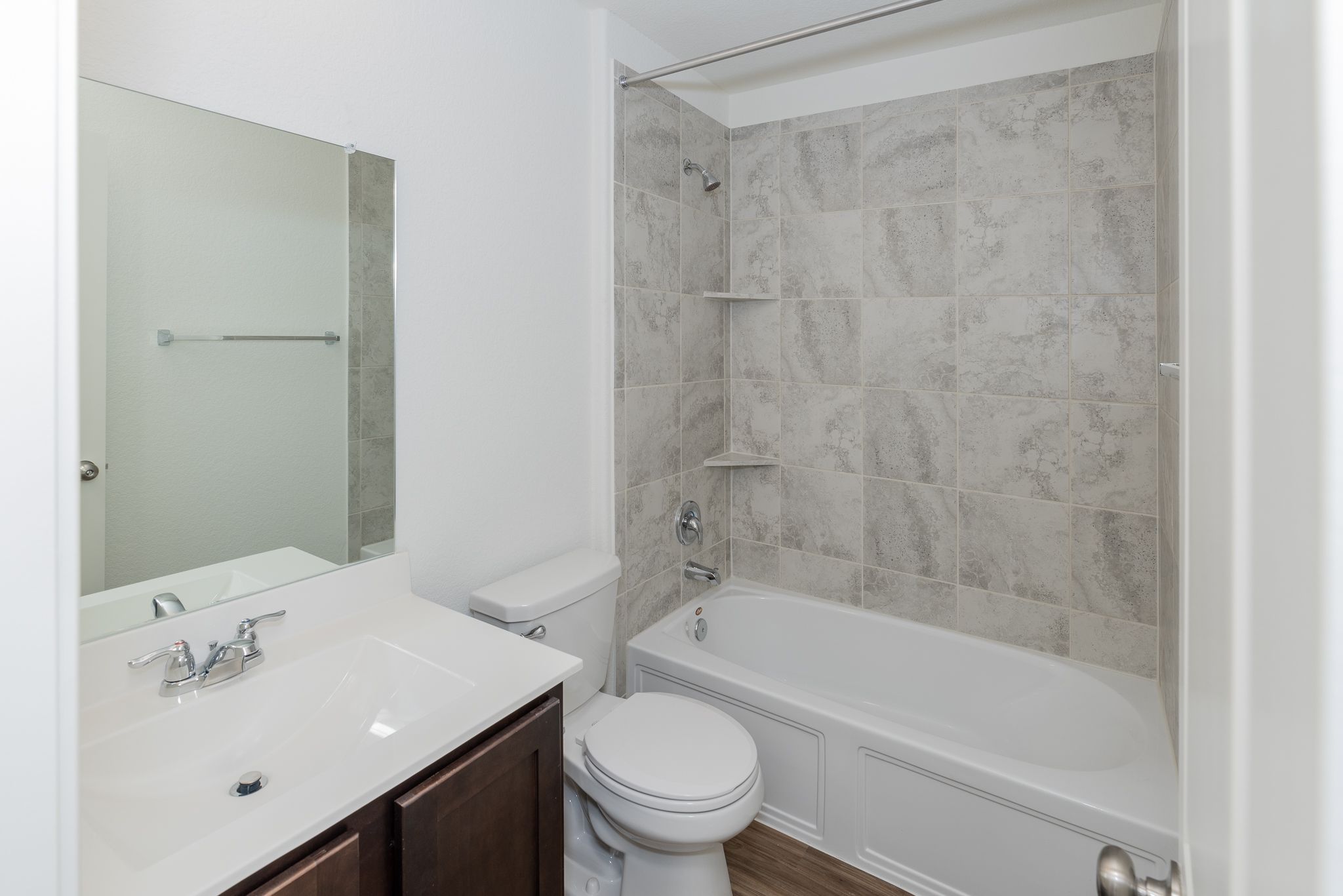 509 Greatest Gift Way Jarrell, TX 76537 - Photo 22 of 28 a bathroom with a bathtub shower sink vanity and toilet