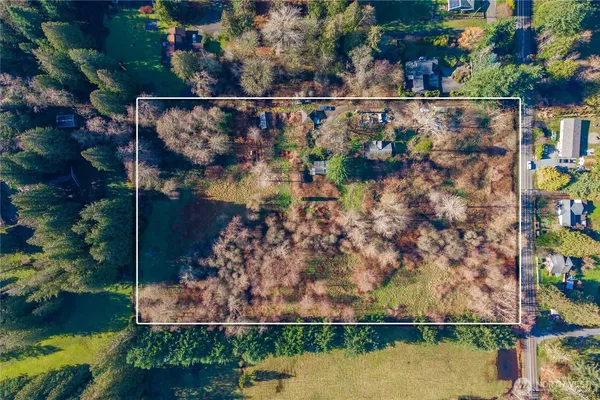 an aerial view of house with a swimming pool