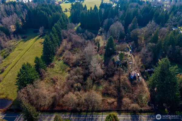 a view of a lake with a house in a background