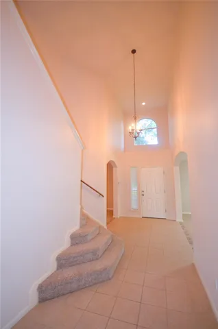 a view of a hallway with staircase