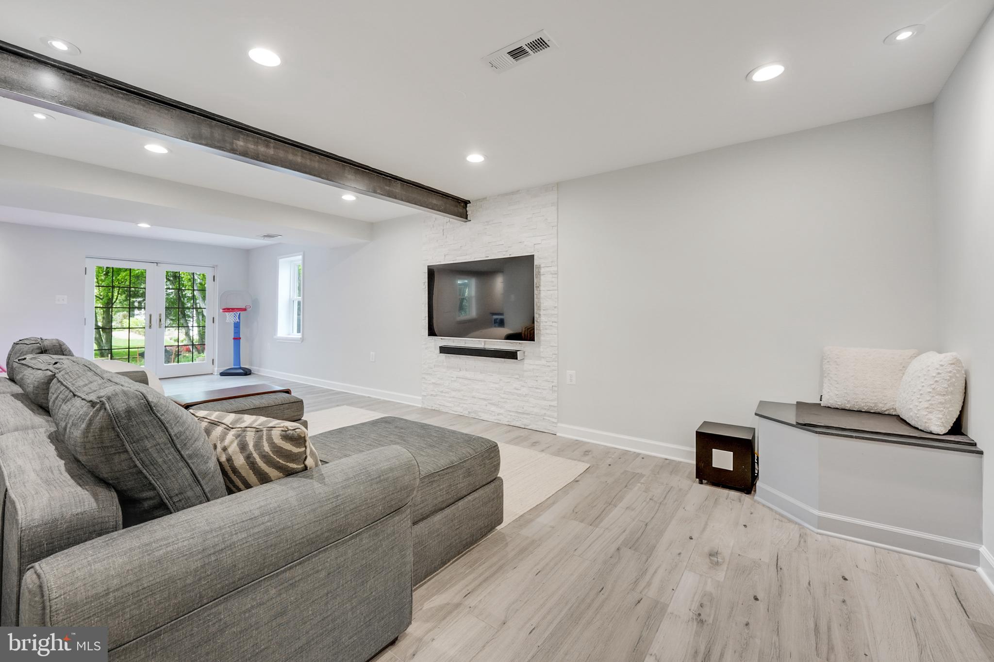 1610 Autumnwood Drive Reston, VA 20194 - Photo 41 of 55 Walkout recreation room with exposed beam