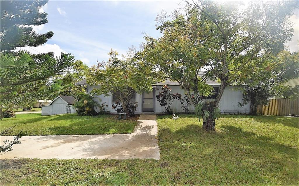 3850 Southeast Middle Street Stuart, FL 34997 - Photo 3 of 11 a view of a yard with palm trees