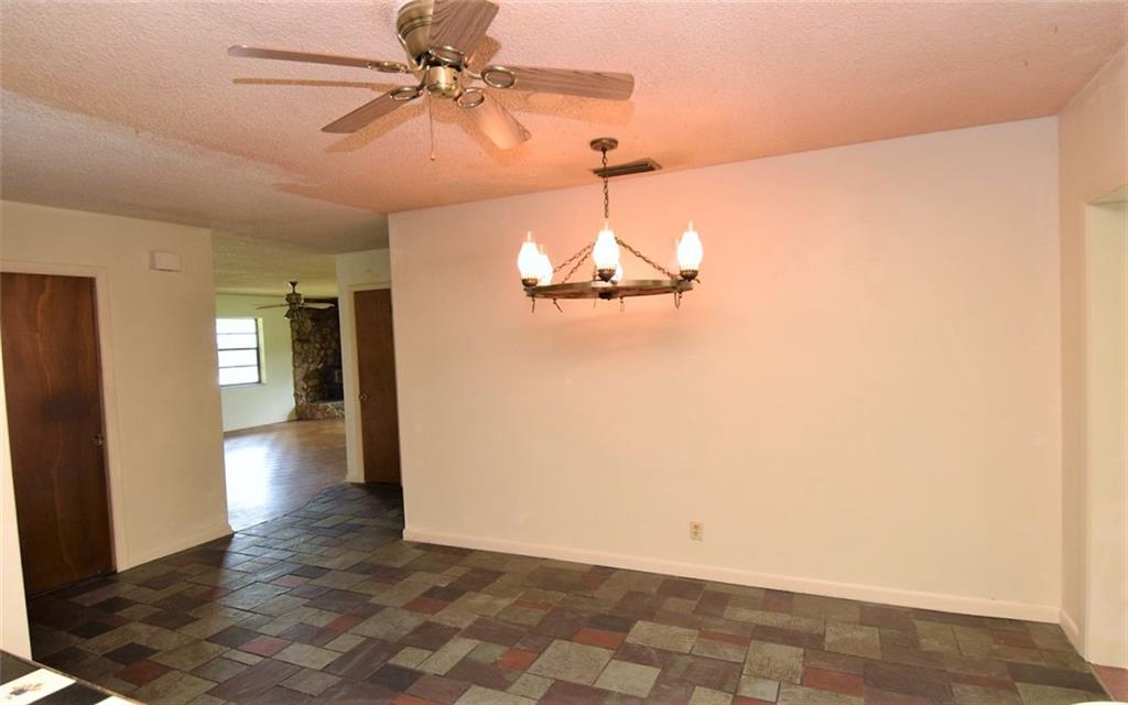 3850 Southeast Middle Street Stuart, FL 34997 - Photo 8 of 11 a view of a chandelier fan and wooden floor