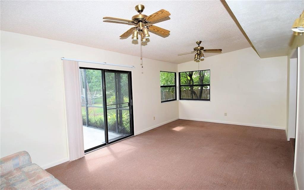 3850 Southeast Middle Street Stuart, FL 34997 - Photo 10 of 11 an empty room with windows and fan