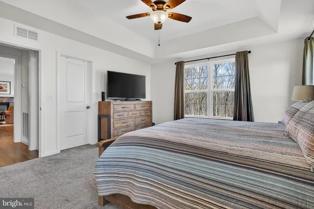 a bathroom with a double vanity sink toilet and a mirror