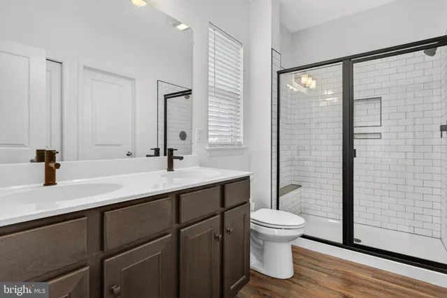 a bathroom with a sink vanity and a mirror