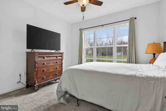 a balcony with wooden floor and fence