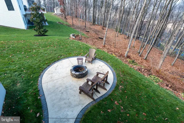 a aerial view of a house with backyard