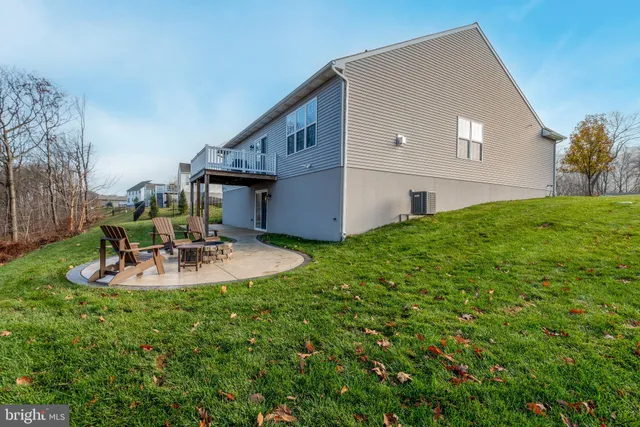 a aerial view of a house with a yard