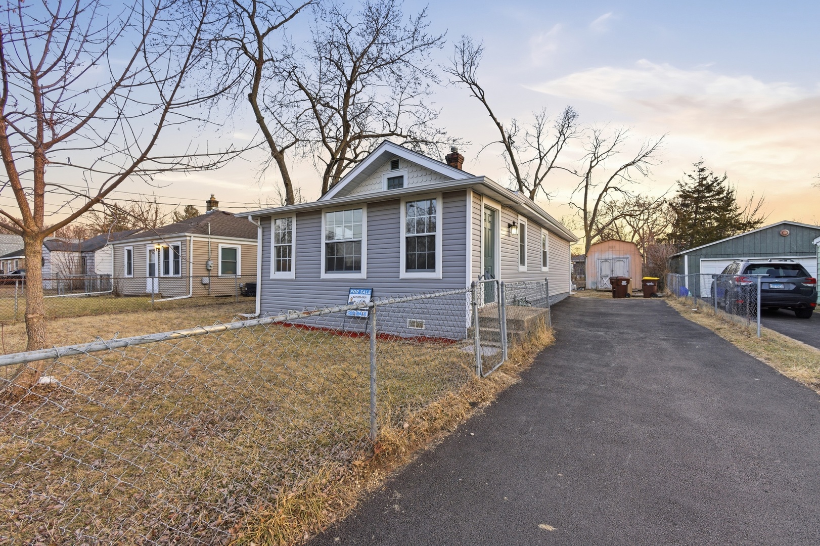 521 Fitch Road Rockford, IL 61109 - Photo 1 of 10 a front view of a house with a yard and garage